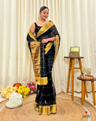 Women wearing soft black mulmul saree in breathable cotton, perfect for elegant evening celebrations