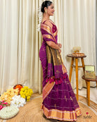 Women wearing elegant purple mulmul cotton saree with handcrafted finish from ShopAaMe for traditional festive functions