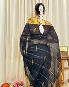 Women wearing soft black mulmul saree in breathable cotton, perfect for elegant evening celebrations