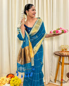 Women wearing elegant blue mulmul cotton saree with handcrafted finish for traditional daytime functions