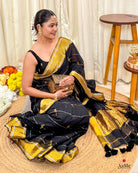 Women wearing soft black mulmul saree in breathable cotton, perfect for elegant evening celebrations