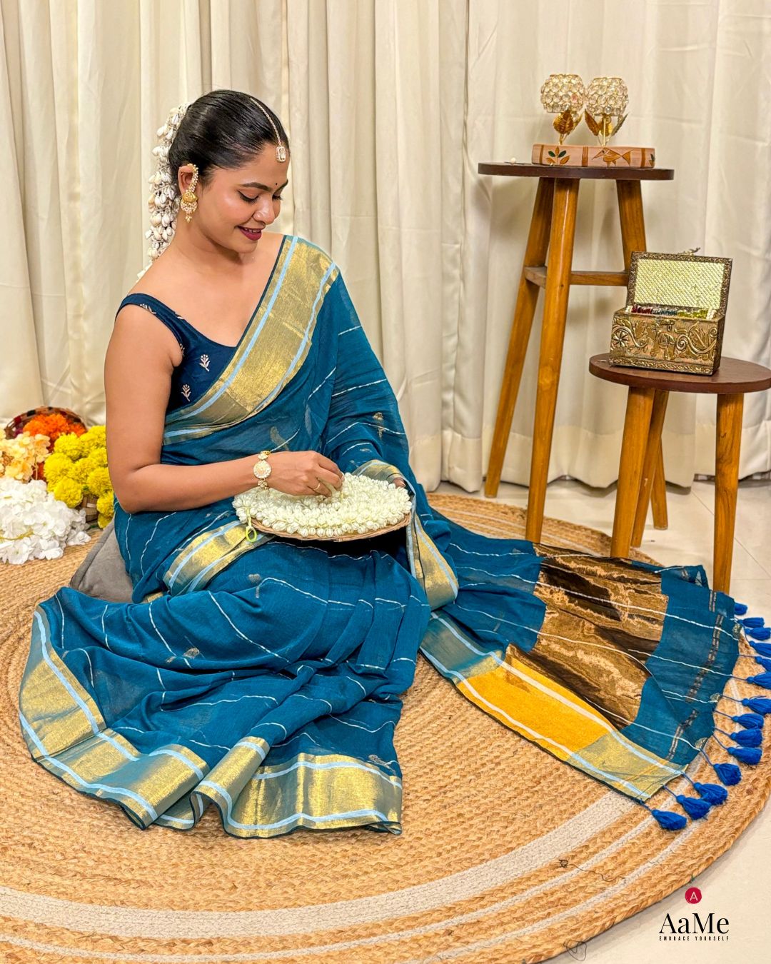 Women wearing elegant blue mulmul cotton saree with handcrafted finish for traditional functions