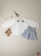 Capri Blouse and Amalfi Skort set close-up of embroidered Peter Pan collar and striped fabric