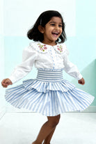 Capri Blouse and Amalfi Skort set styled on child showing coordinated outfit fit
