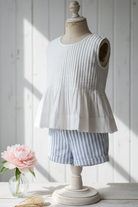 Vienna Blouse close-up of pintuck pleated front and button placket in organic cotton