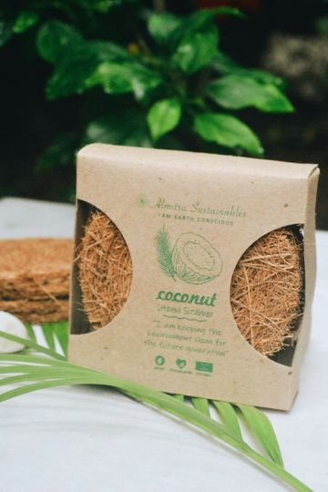 Front view of Almitra Sustainables' Coconut Utensil Scrubber Pack of 3, displayed in eco-friendly kraft paper packaging, promoting sustainable and plastic-free cleaning solutions.