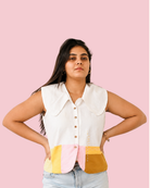 Woman wearing collared shirt and posing