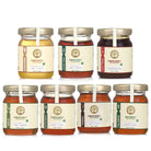 Collection of 7 premium honey varieties featuring raw forest honey, Himalayan honey, tribal honey, and rare wild honey from India