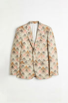 A men's single-breasted linen blazer with a beige base and an all-over abstract floral pattern in pink, orange, and gray, displayed flat against a white background.