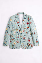 A light blue-green floral linen blazer with red, yellow, and blue embroidered flowers, shown flat against a white background.