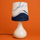Lamp with a marbled design on an orange background