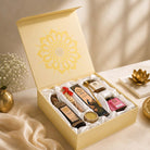 Open gift box with various items on a decorative table