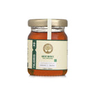 Premium raw honey sampler pack with seven distinct forest honey varieties in elegant glass jars for gifting and wellness