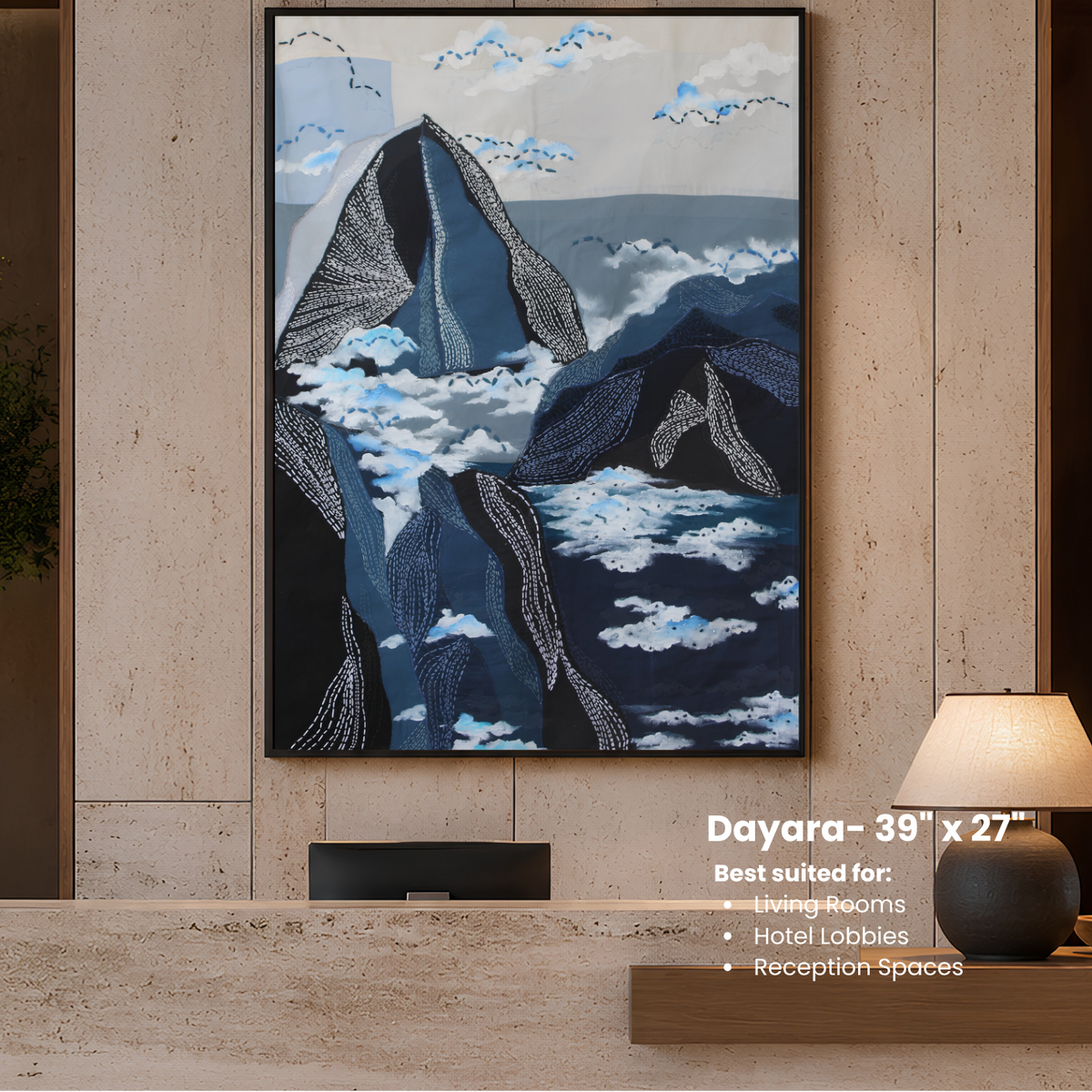 Framed artwork of mountains and clouds on a wall in a modern interior setting.