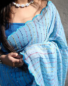 Rainbow Rain blue cotton saree, handcrafted with vibrant embroidery and sequins for a breathable festive look.