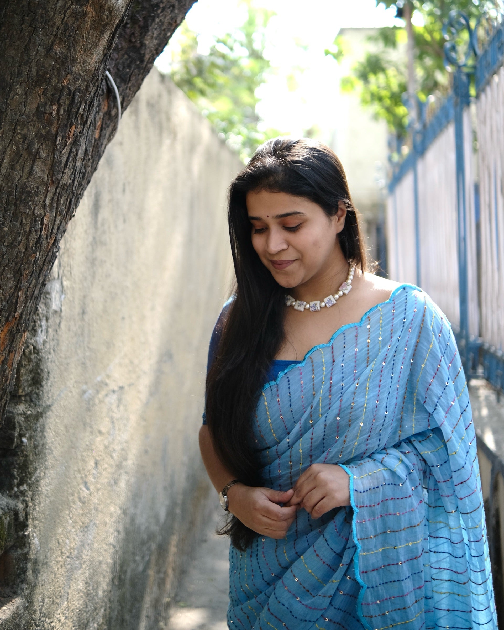 Rainbow Rain blue embroidered mulmul cotton saree with multicolour sequins, a lightweight breathable saree for summer and festive wear.