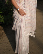 White mulmul cotton saree with kantha and sequins embroidery, a breathable saree for festive occasions and warm days.