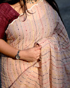 Ivory mulmul cotton saree with delicate embroidery, soft airy elegance for summer styling and festive moments.