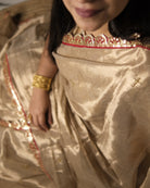 Mulmul Tissue Festive/Party Wear saree for the wedding season in  gold colour  with red Sari border and Zardozi/Jarsousi  work on entire saree, metallic finish