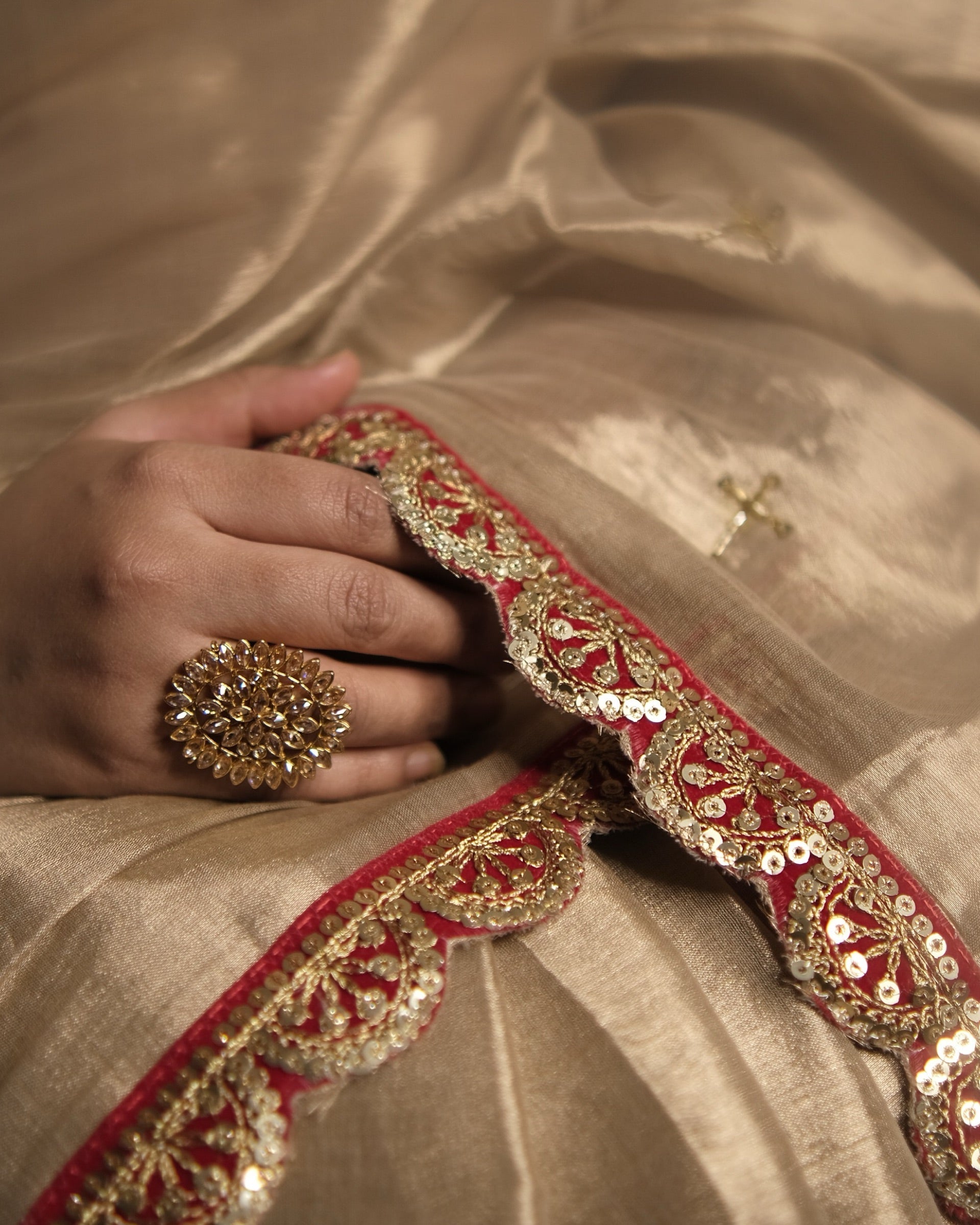 Mulmul Tissue Festive/Party Wear saree for the wedding season in  gold colour  with red Sari border and Zardozi/Jarsousi  work on entire saree, metallic finish