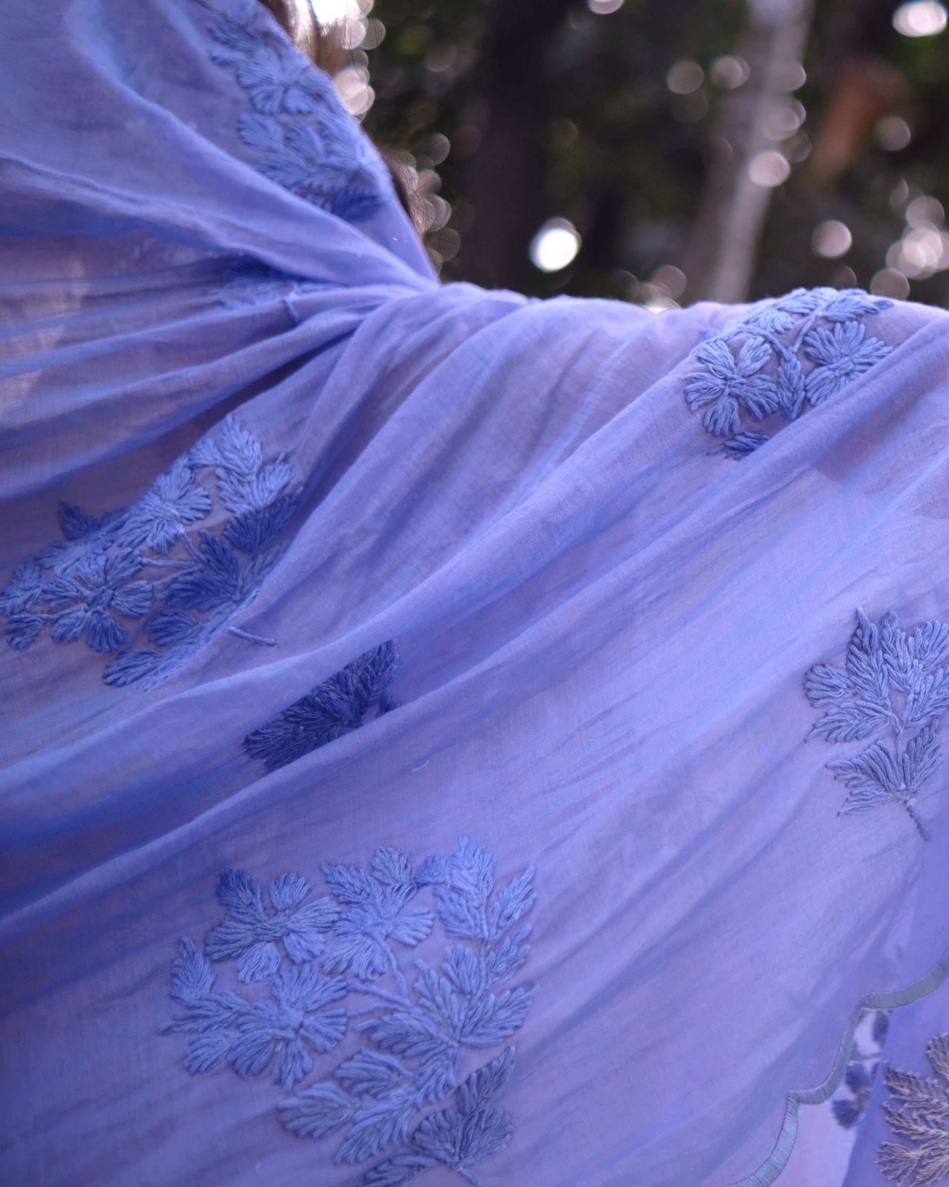 Soft and Comfortable mulmul cotton saree with Chikankari machine work and cutwork border in self tones on dual toned lavender