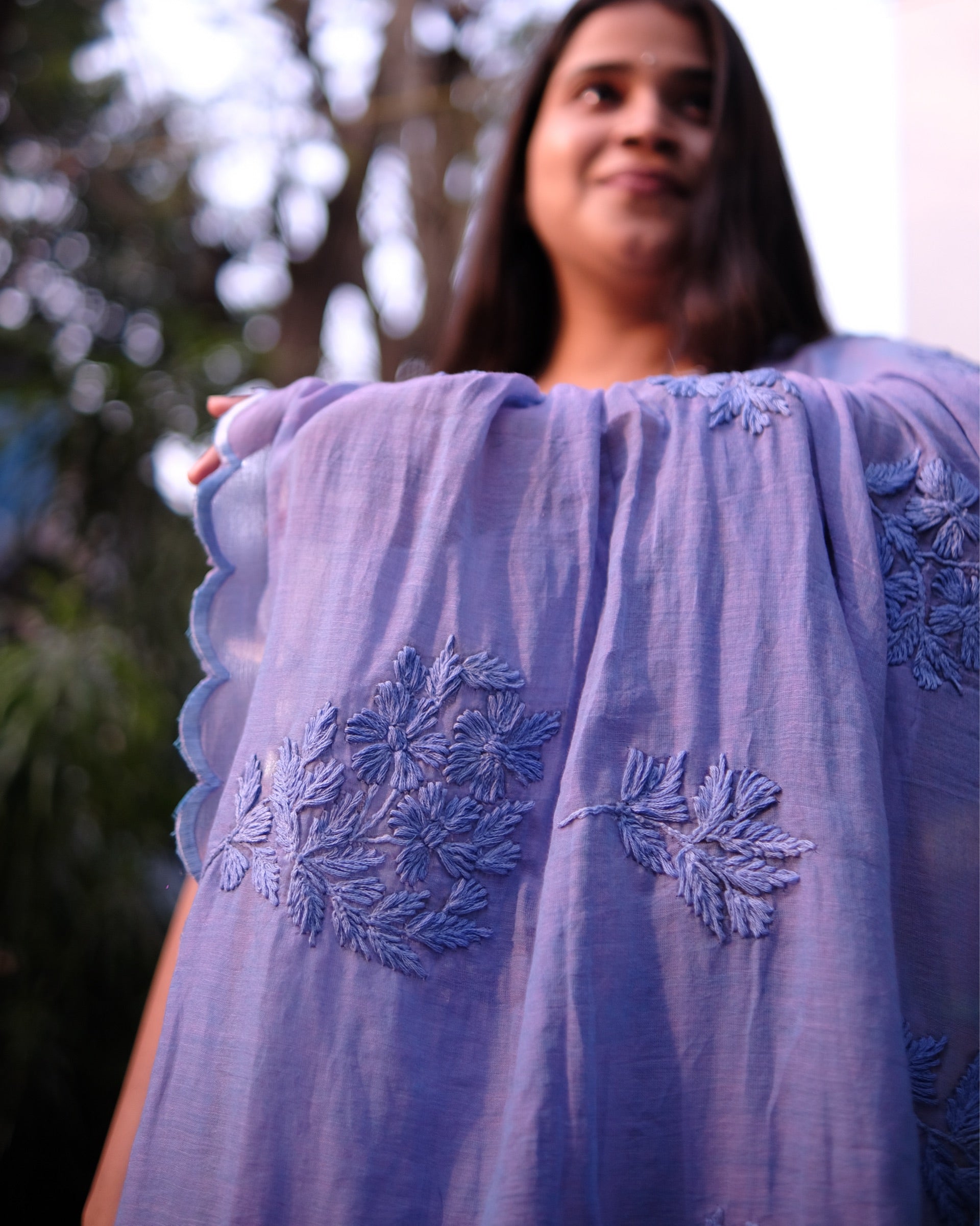 Soft and Comfortable mulmul cotton saree with Chikankari machine work and cutwork border in self tones on dual toned lavender