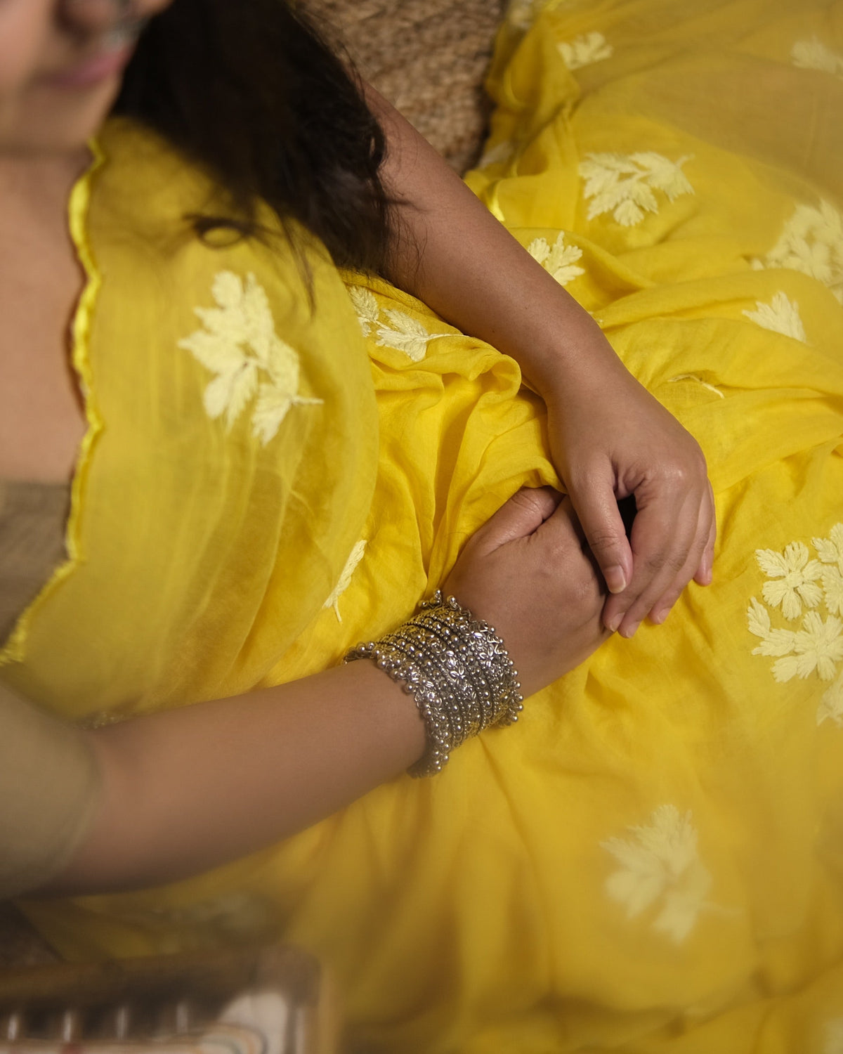 Kasturi yellow cotton saree, handcrafted with delicate chikankari work for a breathable and graceful look.