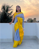 Grey handloom cotton saree with golden satin border