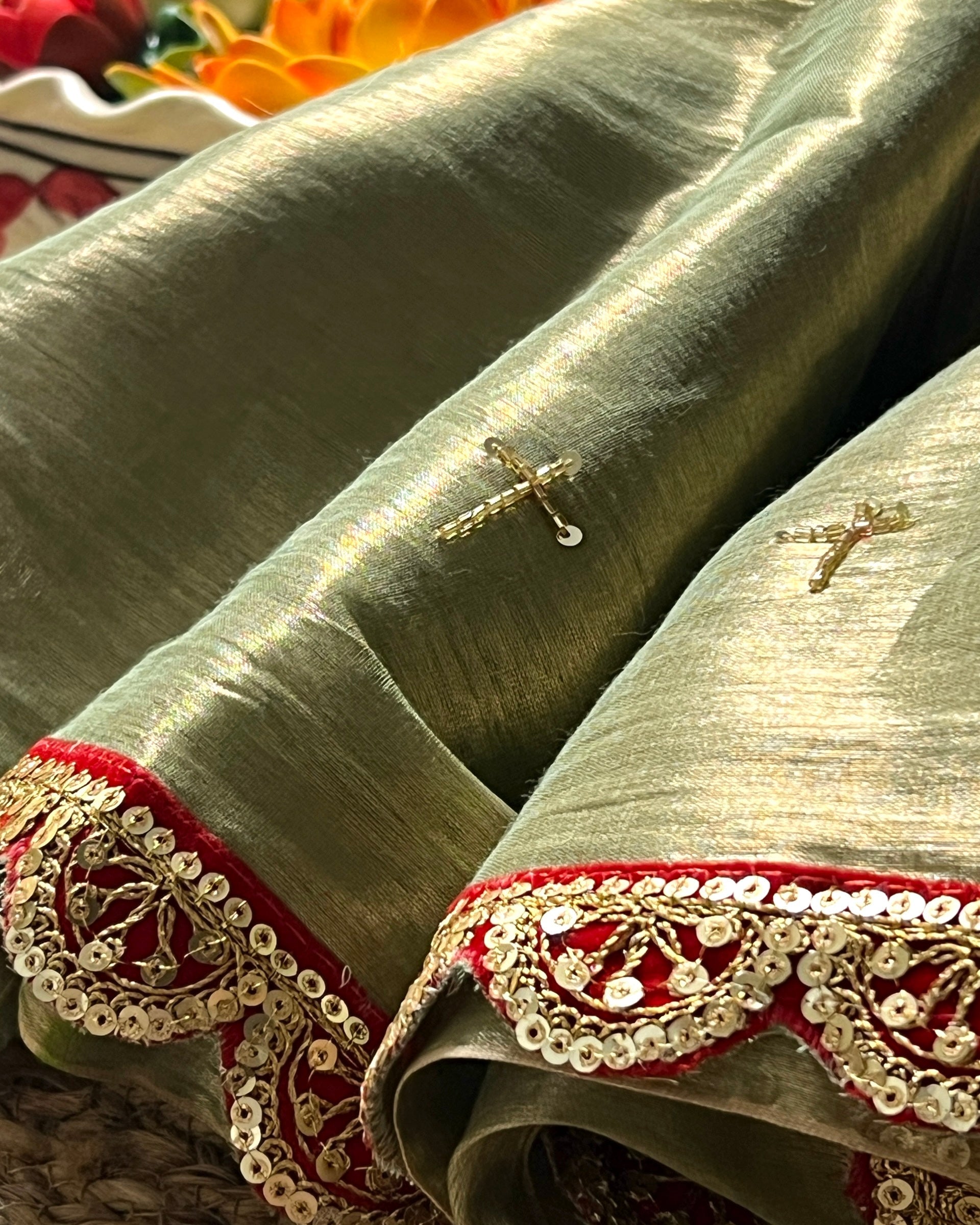 Mulmul Tissue Festive/Party Wear saree for the wedding season in green with red Sari border and Zardozi/Jarsousi  work on entire saree, metallic finish