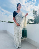 Off white soft and comfortable khadi cotton saree printed in green itsy bitsy patterns