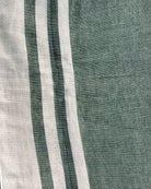 Off white soft and comfortable khadi cotton saree printed in green itsy bitsy patterns