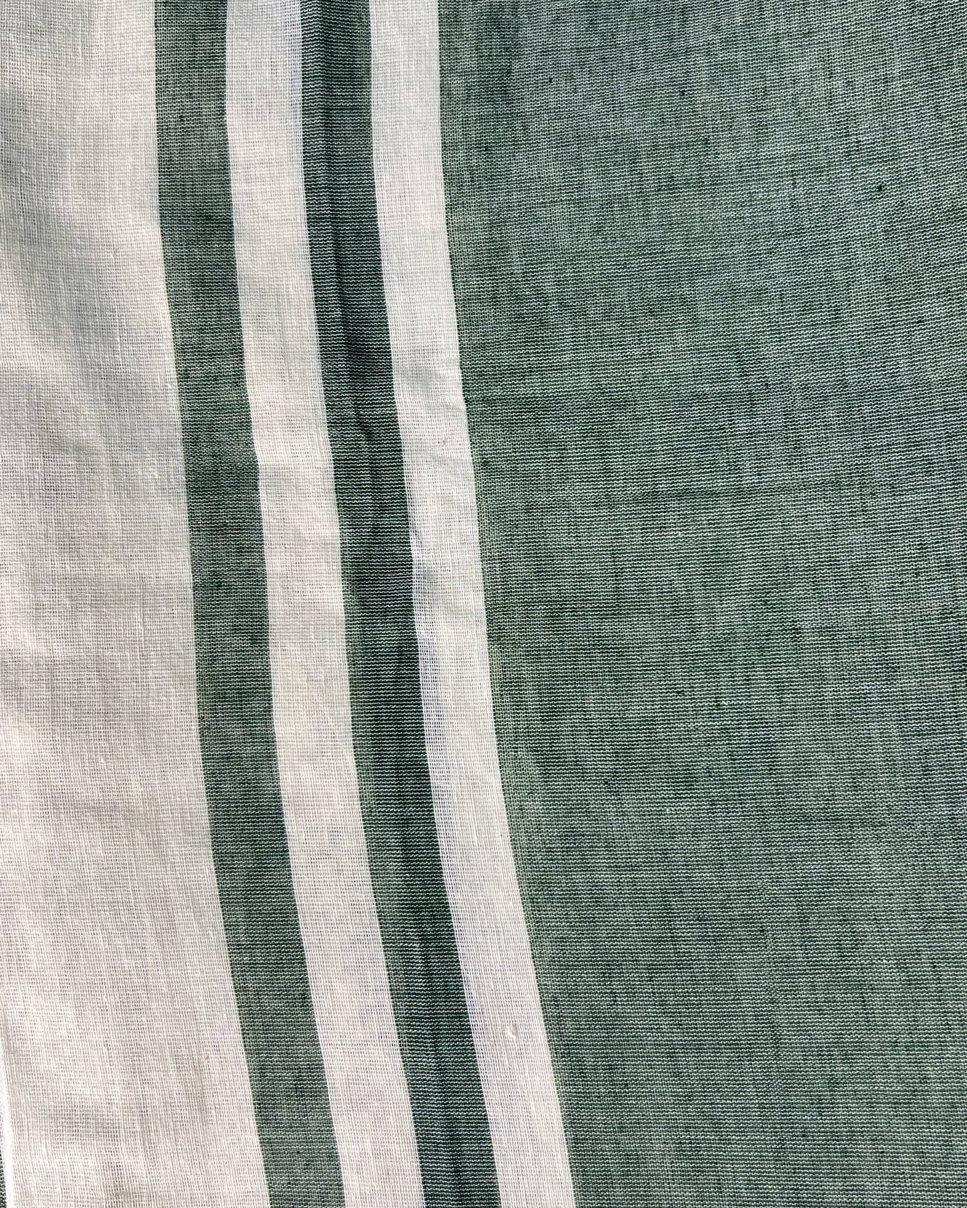 Off white soft and comfortable khadi cotton saree printed in green itsy bitsy patterns