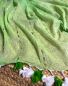 Soft and Comfortable mulmul cotton saree in green shade with sequin emblishment for festive or party wear at reasonable price