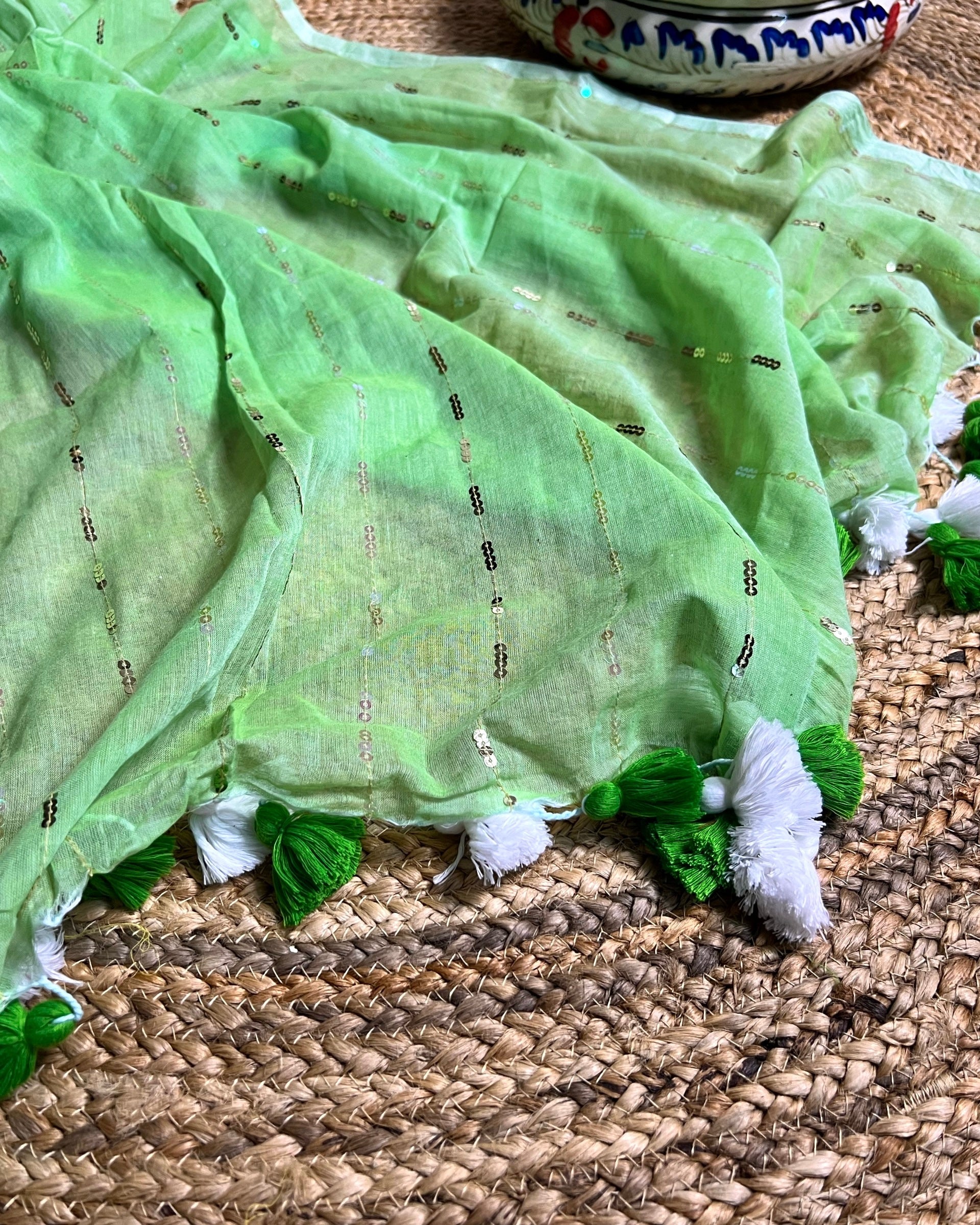 Soft and Comfortable mulmul cotton saree in green shade with sequin emblishment for festive or party wear at reasonable price