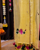 Hand embroidered yellow mulmul cotton saree with floral lotus design