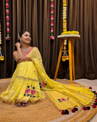 Elegant yellow mulmul saree with delicate handcrafted embroidery
