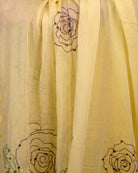 Yellow mulmul cotton saree with rose sequins embroidery, soft airy elegance for festive moments and summer styling.