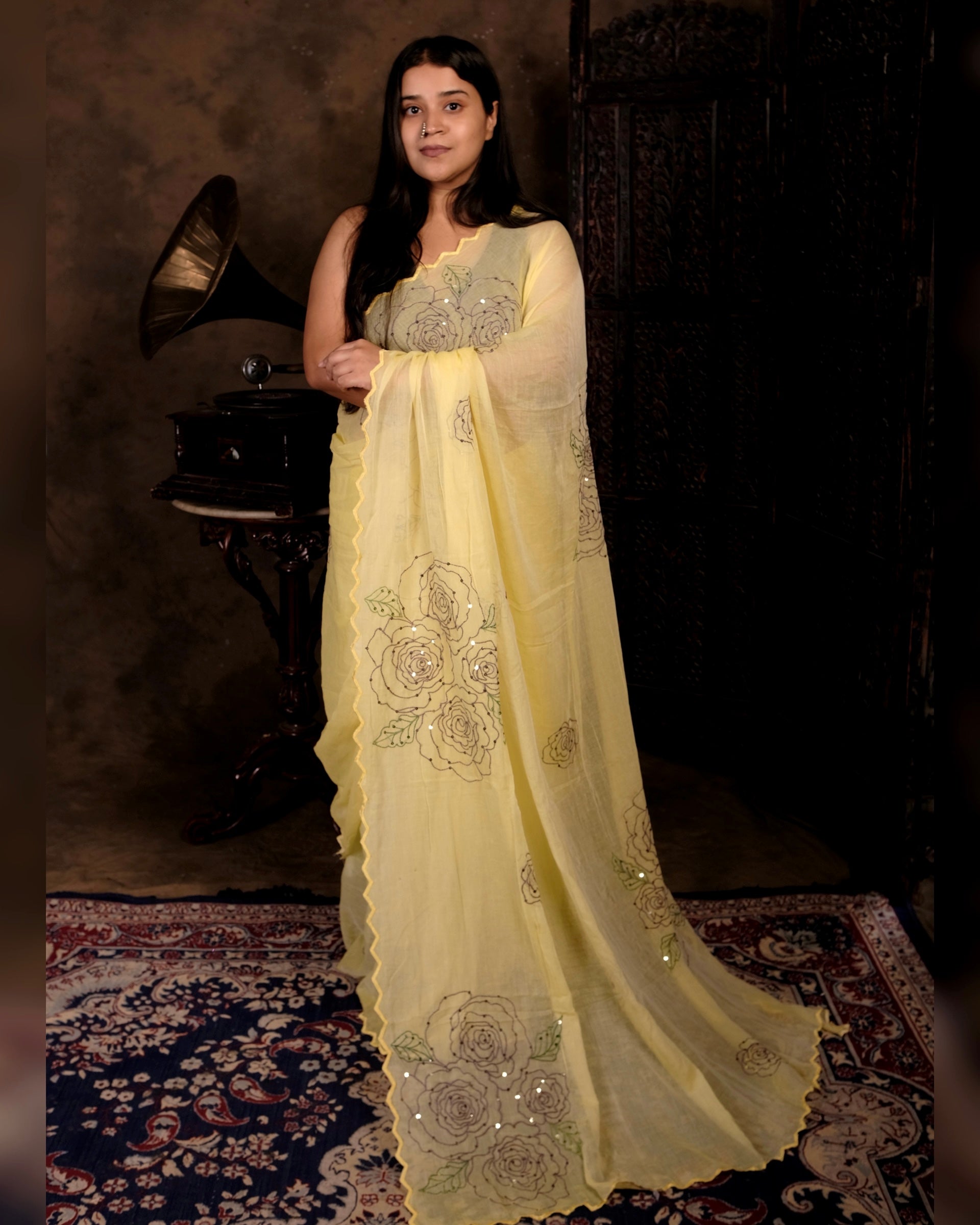 Yellow mulmul cotton saree with rose detailing and sequins, a breathable festive saree for bright summer occasions.