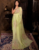 Green mulmul cotton saree with rose sequins embroidery, soft airy elegance for festive moments and summer styling.
