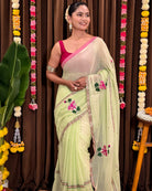 Soft green cotton mulmul saree with delicate handcrafted embroidery