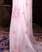 Lightweight white sequins embroidered mulmul cotton saree, designed for festive wear with a soft graceful drape.