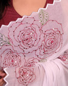 White mulmul cotton saree with rose detailing and sequins, a breathable saree for festive occasions and summer days.