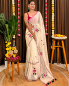 Lightweight white mulmul saree with delicate floral embroidery