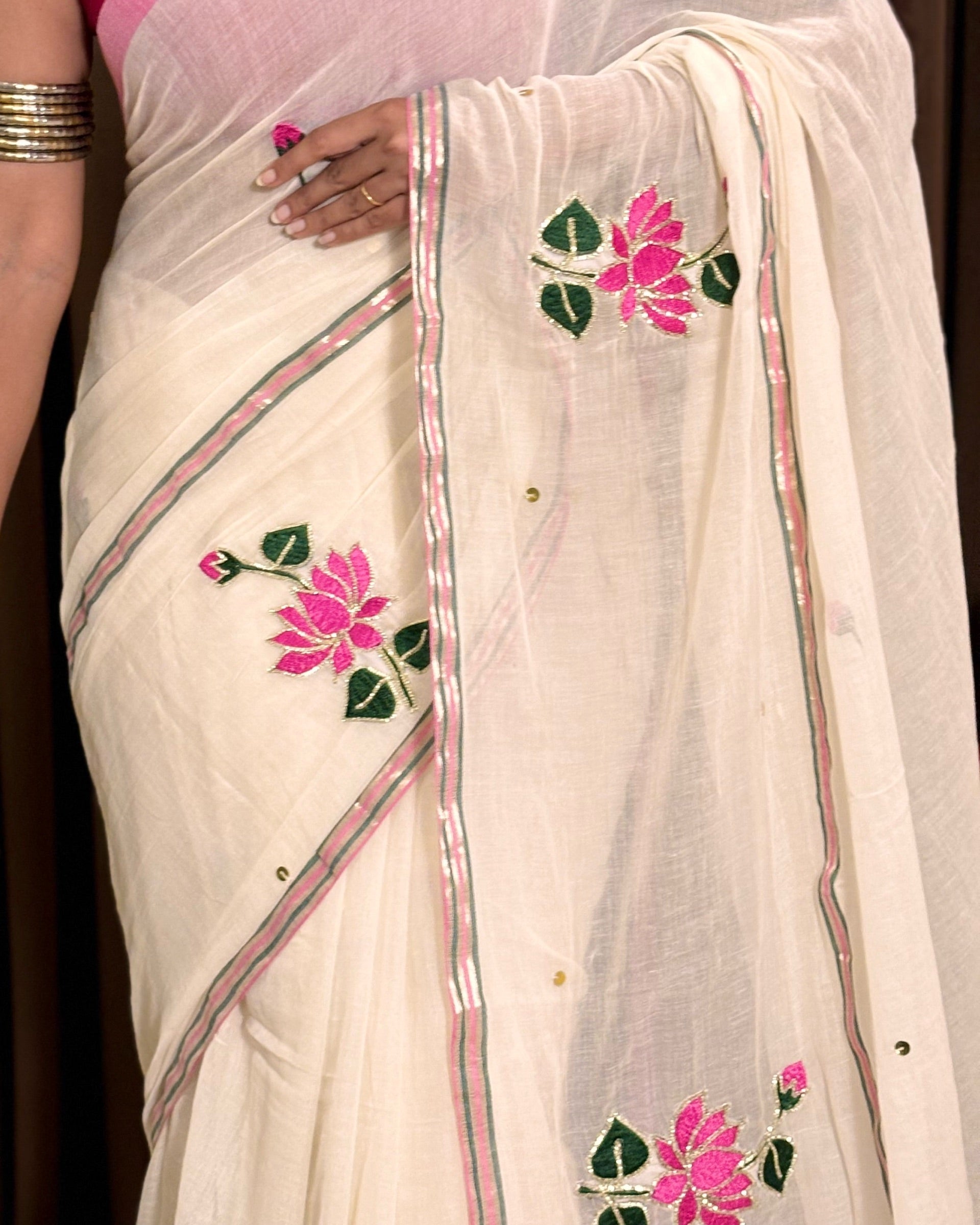 Elegant white mulmul saree with handcrafted embroidery details