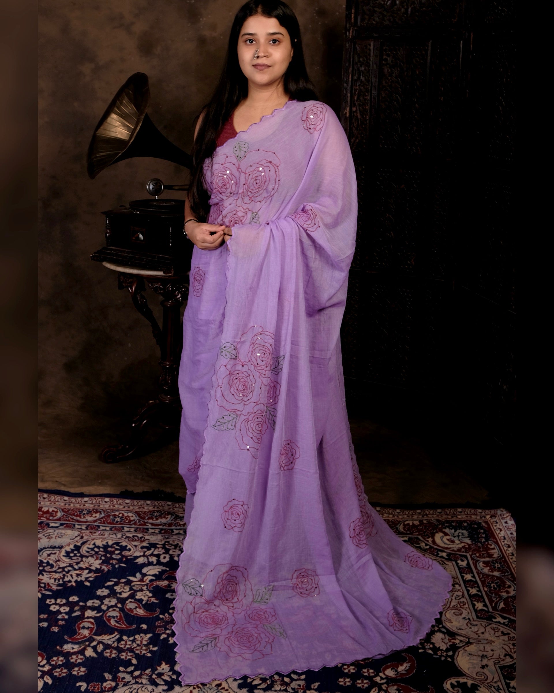 Lightweight purple sequins embroidered mulmul cotton saree, designed for festive wear with a soft graceful drape.