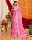 Woman in a pink mulmul cotton saree with sequins embellished border - festive saree