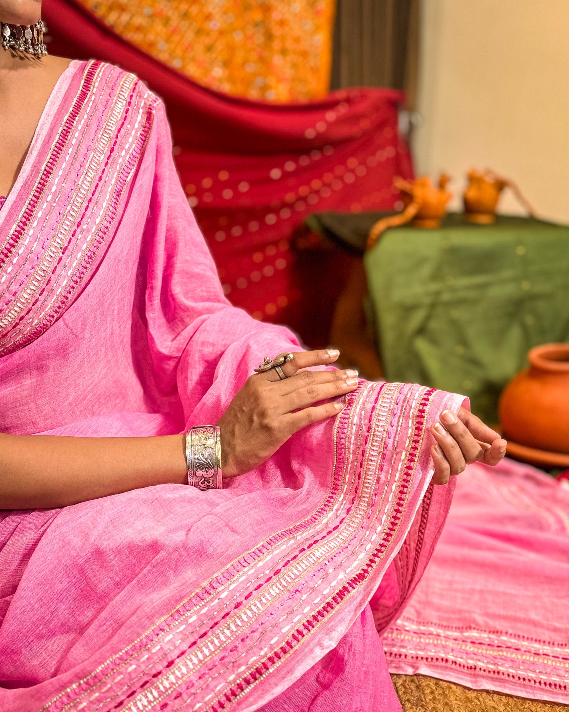 Model wearing Woven Halo pink mulmul cotton saree with graceful sequin detailing