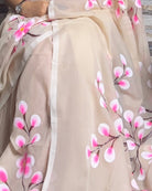 Soft and comfortable light weight white taupe mulmul cotton saree with floral hand painting good for day time wear