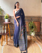 Elegant navy mulmul saree with detailed embroidery for evening wear