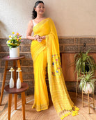Vibrant yellow mulmul saree with bold embroidery lightweight cotton saree